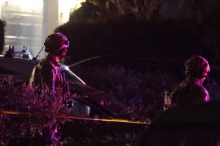 Agents search a house in California linked to the shooting suspect